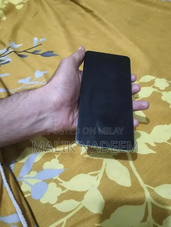 Cell Phone with Charger and Original Box in Pristine Condition