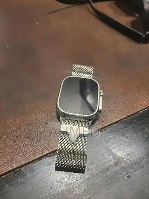 Photo - Apple Watch Ultra 2 Titanium Edition with Original Accessories
