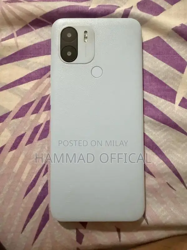 Redmi A2+ Smartphone with Cracked Screen