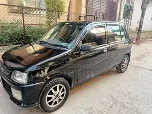 Photo - Daihatsu Cuore 2008 Compact City Car - Fuel Efficient Petrol Hatchback