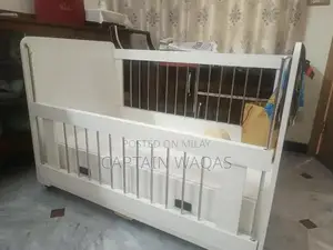 Baby Crib with Storage - Compact and Versatile Infant Bed