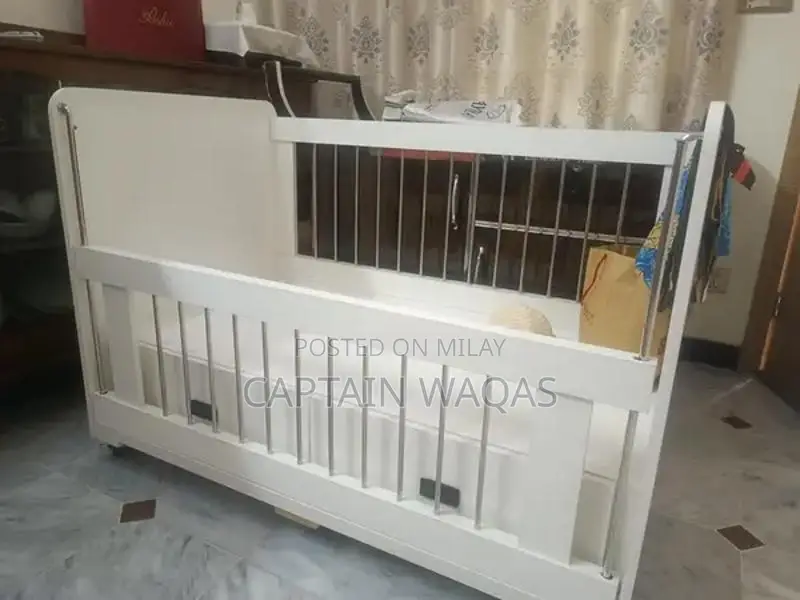 Baby Crib with Storage - Compact and Versatile Infant Bed