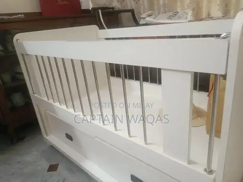 Baby Crib with Storage - Compact and Versatile Infant Bed