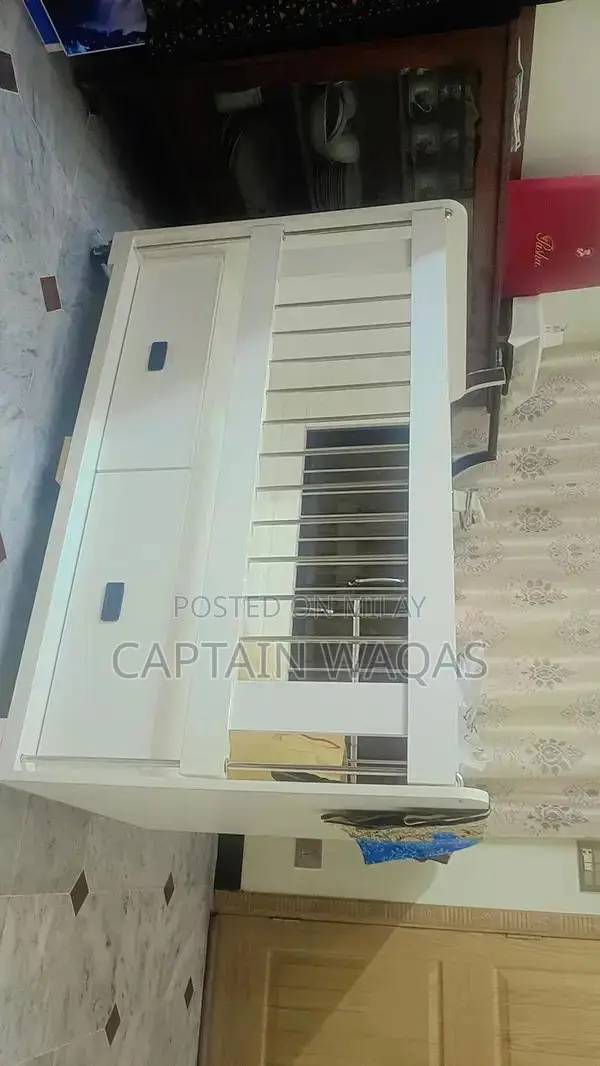 Baby Crib with Storage - Compact and Versatile Infant Bed