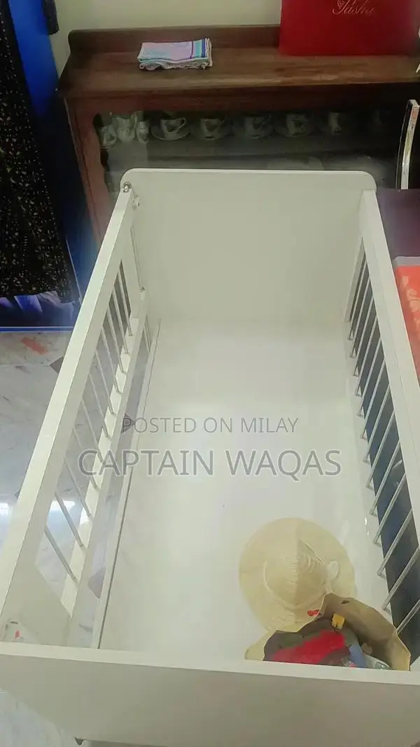 Baby Crib with Storage - Compact and Versatile Infant Bed