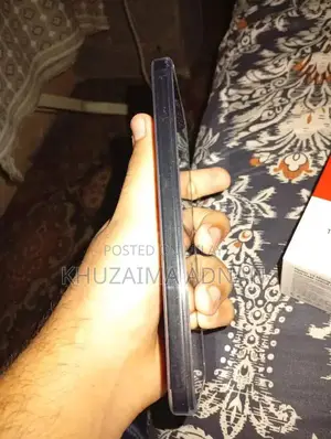 Redmi Smartphone with Original Charger in Brand New Condition