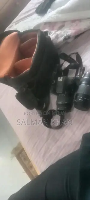 Photo - Canon 1300D DSLR Camera with Accessories and Extra Lens Cap