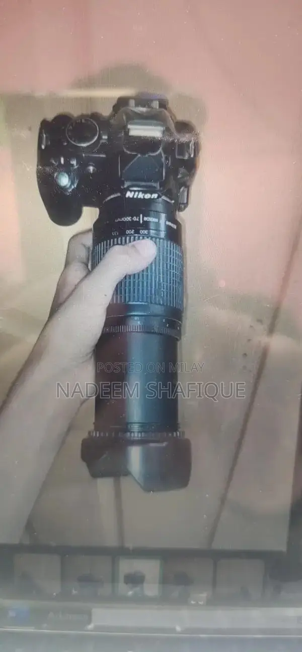 Nikon D3100 DSLR Camera with Accessories and Multiple Shooting Modes