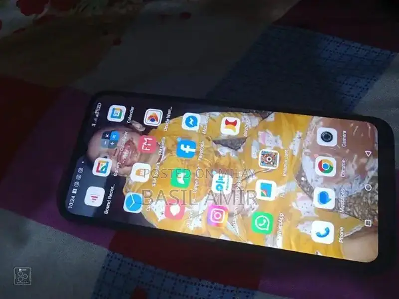 Compact Smartphone with Glass Display and Moderate Storage