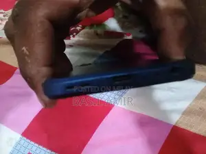 Compact Smartphone with Glass Display and Moderate Storage