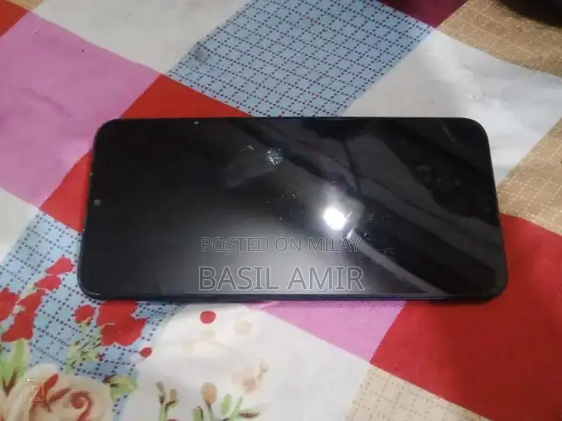 Compact Smartphone with Glass Display and Moderate Storage