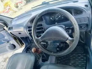 2011 Daihatsu Coure Compact Car with Air Conditioning