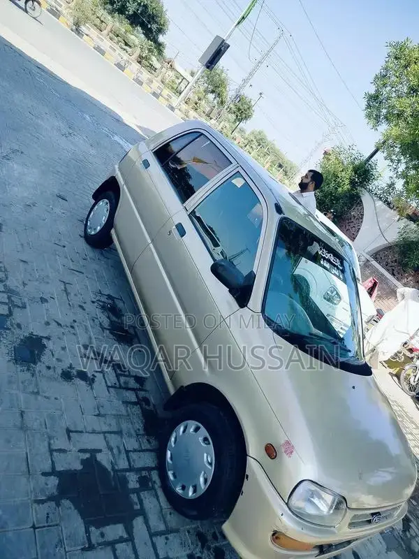 2011 Daihatsu Coure Compact Car with Air Conditioning