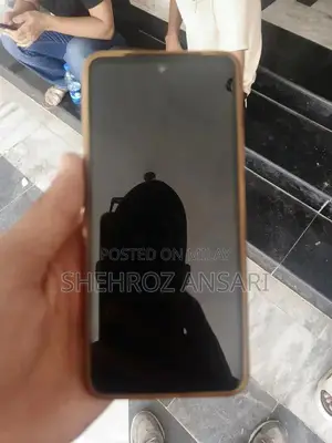 Well-Maintained Smartphone with Charger