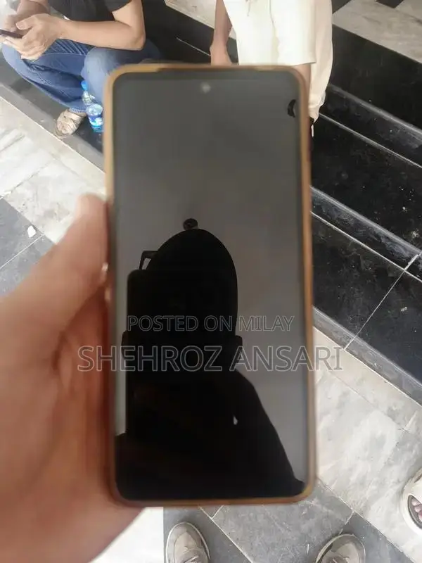 Well-Maintained Smartphone with Charger