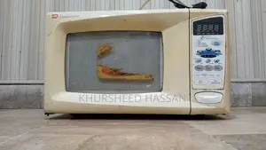 Photo - Dawlance Medium Used Microwave in Good Working Condition