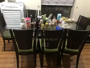 Photo - Dining table with 8 chairs .