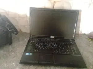 Photo - Stone Laptop with Missing Buttons - Portable Computing Device
