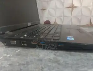 Stone Laptop with Missing Buttons - Portable Computing Device