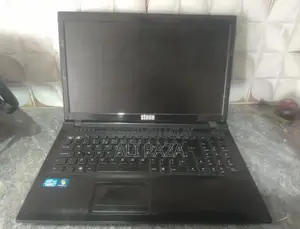 Stone Laptop with Missing Buttons - Portable Computing Device