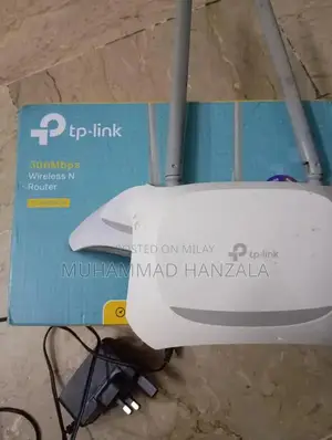 Photo - TP-Link Router with Power Adapter and Original Packaging