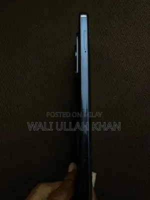 Sleek Black Smartphone with Original Accessories