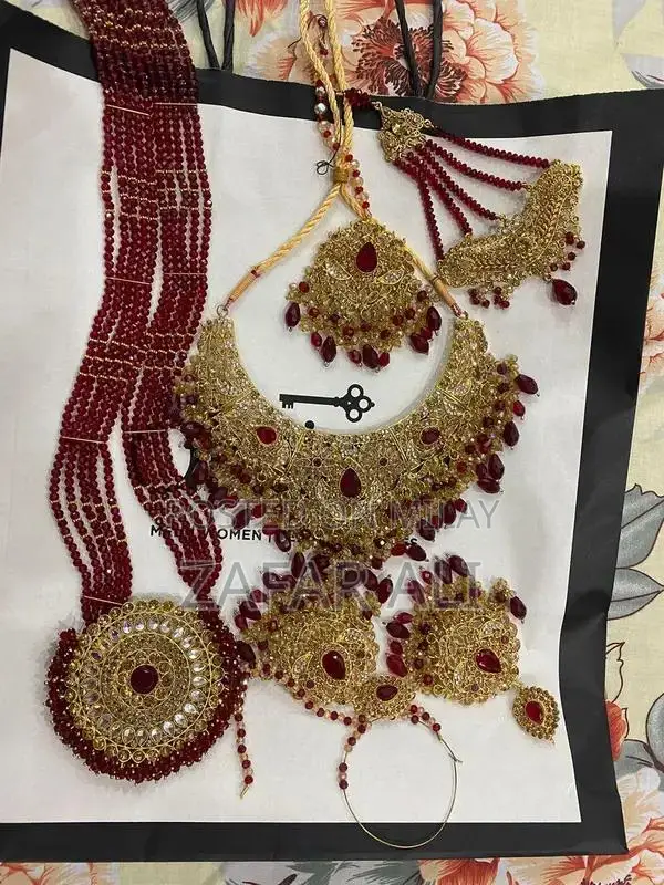 Elegant Reddish Maroon Bridal Dress with Complete Jewelry Set