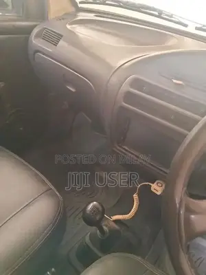 Photo - Daihatsu Cuore Compact City Car - Efficient Urban Vehicle