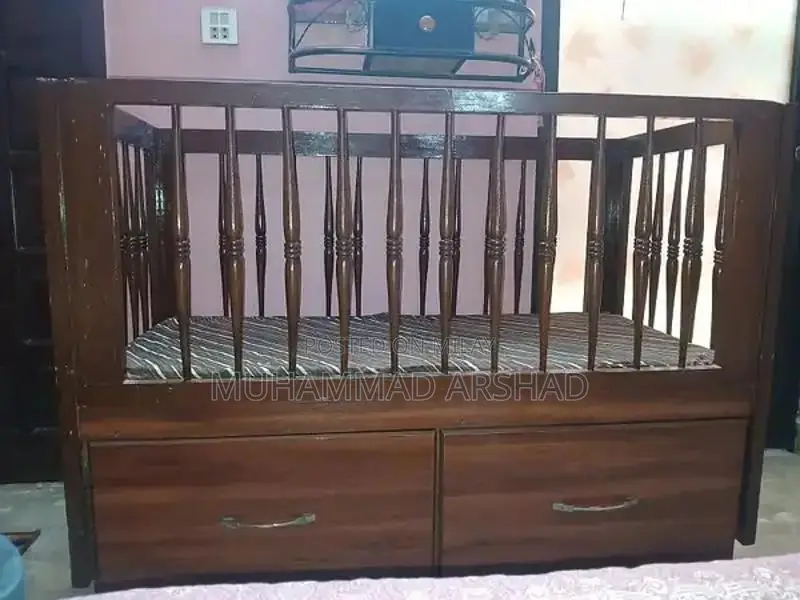 Spacious Baby Cot with Storage Drawers and Wheels