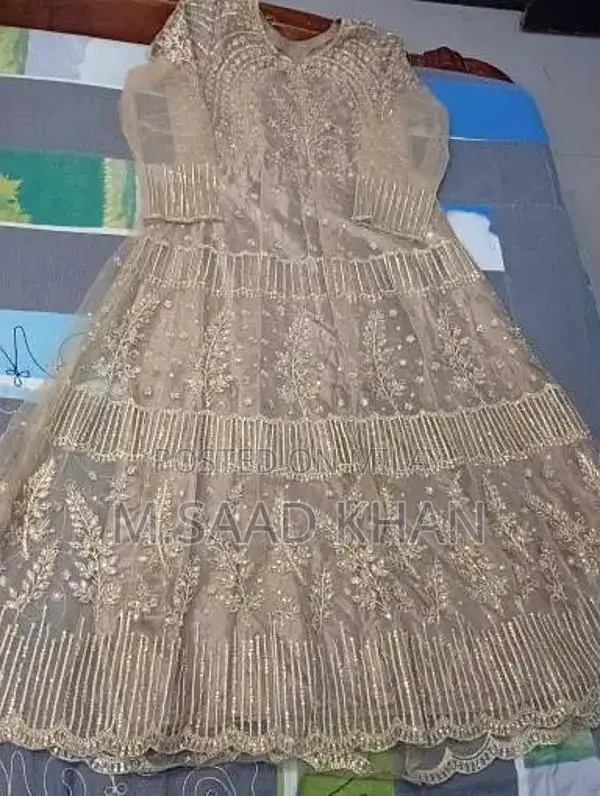 Elegant Net Frock with Stone and Karhai Embellishments