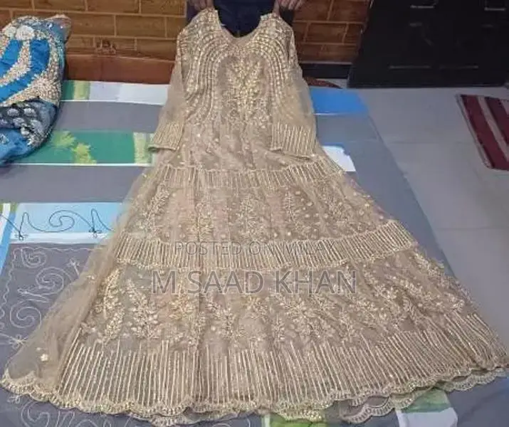 Elegant Net Frock with Stone and Karhai Embellishments