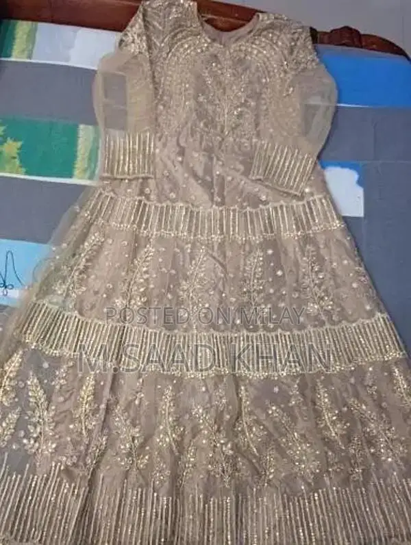 Elegant Net Frock with Stone and Karhai Embellishments