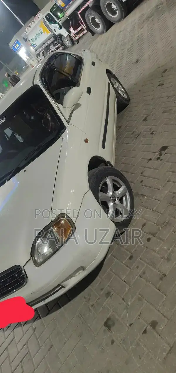 2004 Suzuki Baleno JXR Sedan - Well Maintained White Vehicle