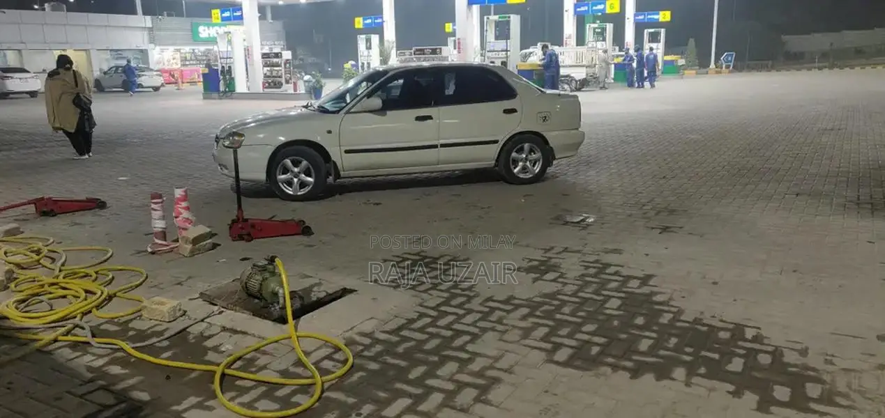 2004 Suzuki Baleno JXR Sedan - Well Maintained White Vehicle