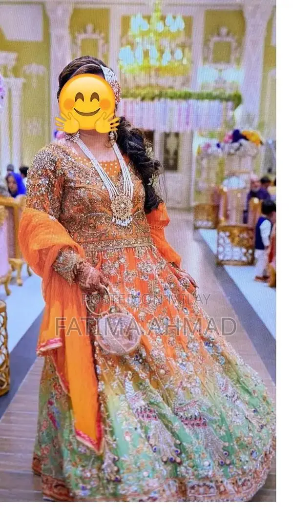 Elegant Bridal Mehndi Lehnga with Peacock Embroidery and Antique Detai