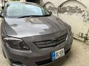 Photo - Toyota Corolla GLI 1.3 Manual Sedan 2009