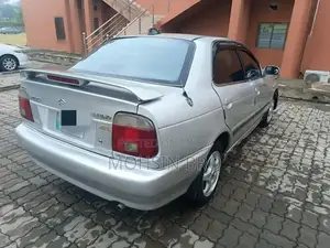 Suzuki Baleno JXL Sedan - Manual Transmission Silver Compact Car