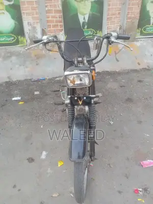 Photo - Honda 70cc Motorcycle - Well-Maintained Condition