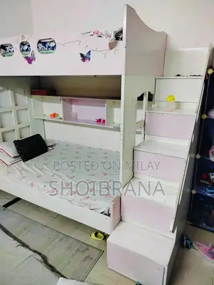 Photo - Pink and White Wooden Bunk Bed in Used Condition