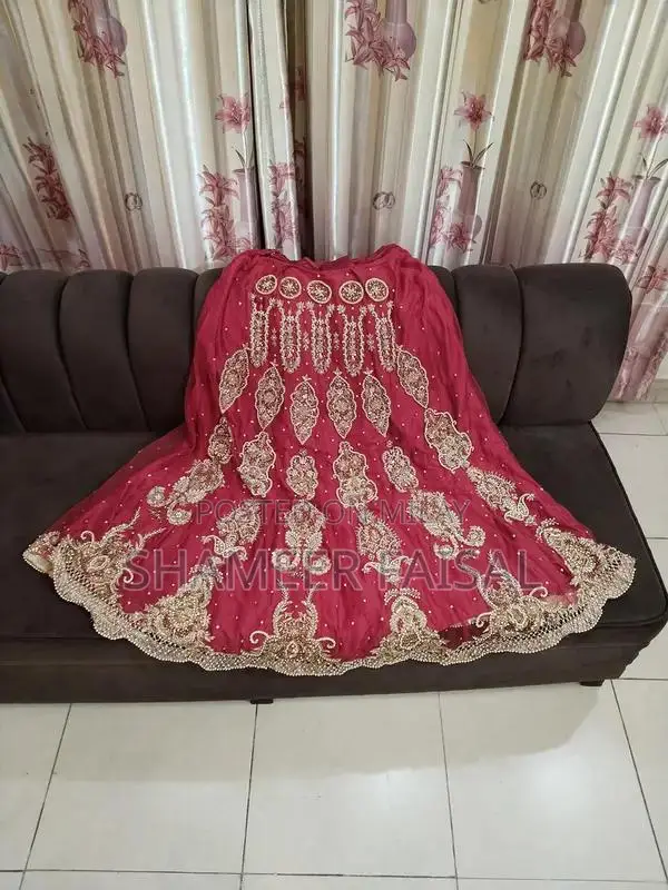 Red Bridal Lehenga with Golden Hand Embroidery and Stones