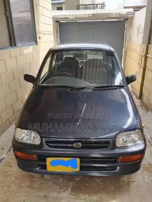Photo - 2004 Daihatsu Coure Compact Sedan - Well-Maintained Vehicle