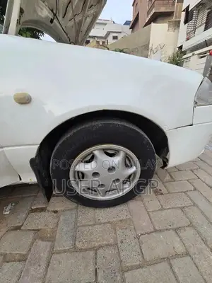 Photo - Suzuki Cultus 2012 VXR White Compact Sedan