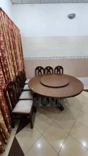 Photo - Wooden Dining Table with 7 Chairs