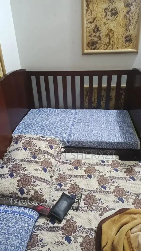 Sturdy Wooden Baby Cot - Excellent Condition