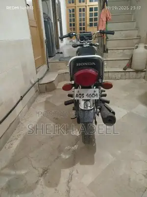 Photo - Honda 125 Motorcycle in Pristine Original Black Condition