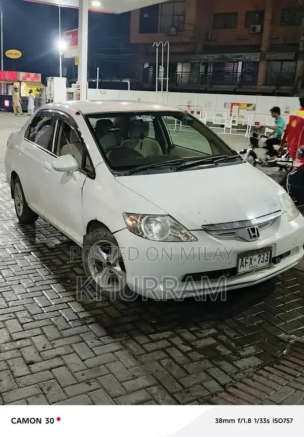 Honda City Automatic Sedan with Disk Brakes and Original Paint