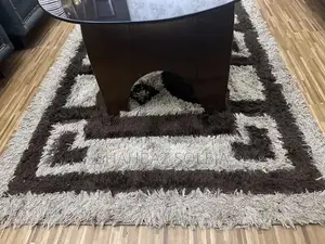 Dark Brown Glass Tea Table with Matching Area Rug