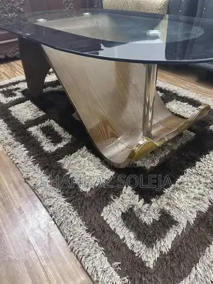 Dark Brown Glass Tea Table with Matching Area Rug
