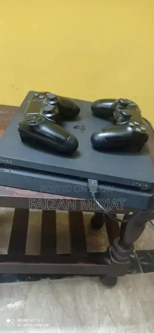 Photo - PlayStation 4 Slim Gaming Console 500GB with 2 Controllers