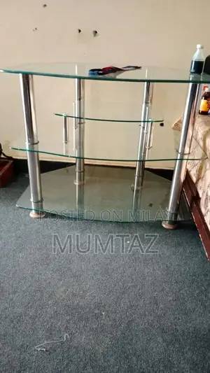 Photo - Modern Glass and Aluminum TV Stand for Gaming and Entertainment